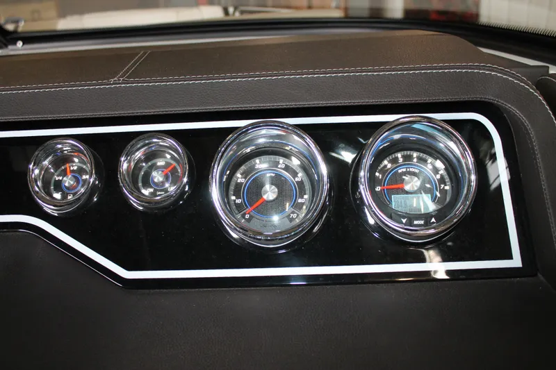 Slide: The Image of Dashboard gauges of a 2018 Sea Ray 280 SLX boat, featuring chrome accents. - 17