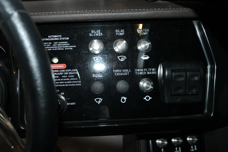 Slide: The Image of Control panel of a 2018 Sea Ray 280 SLX boat with various switches and warnings. - 18