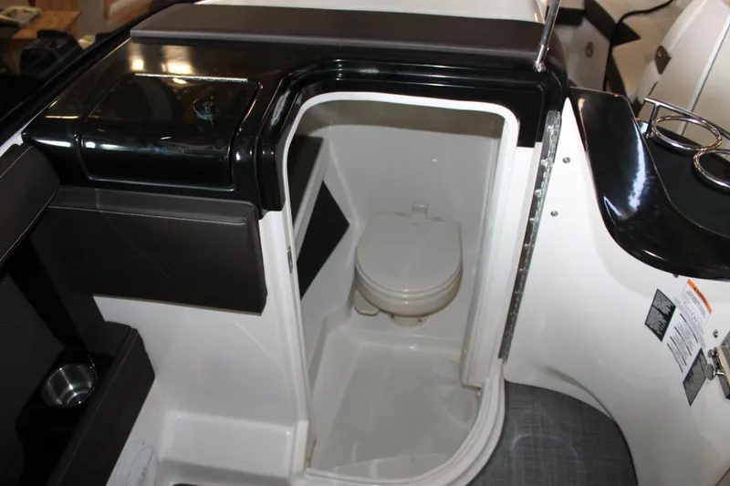 Slide: The Image of 2018 Sea Ray 280 SLX boat interior with compact marine toilet. - 22