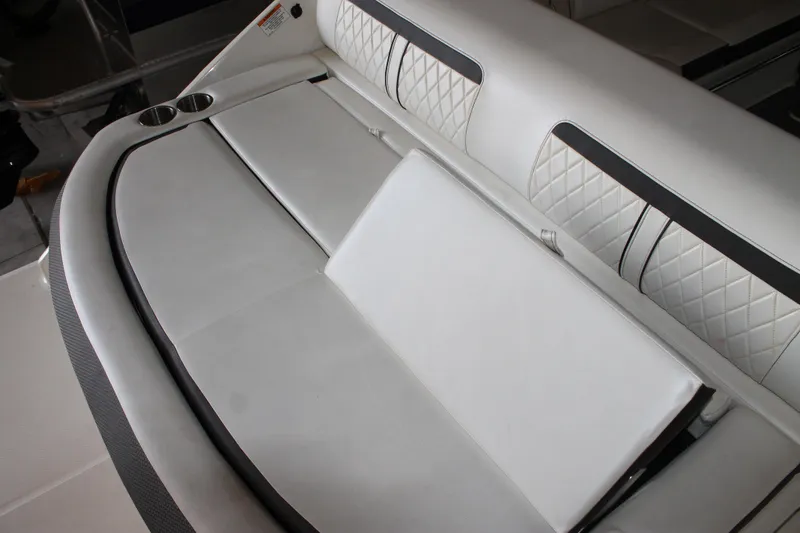 Slide: The Image of Luxurious seating on 2018 Sea Ray 280 SLX boat with quilted upholstery and cup holders. - 9
