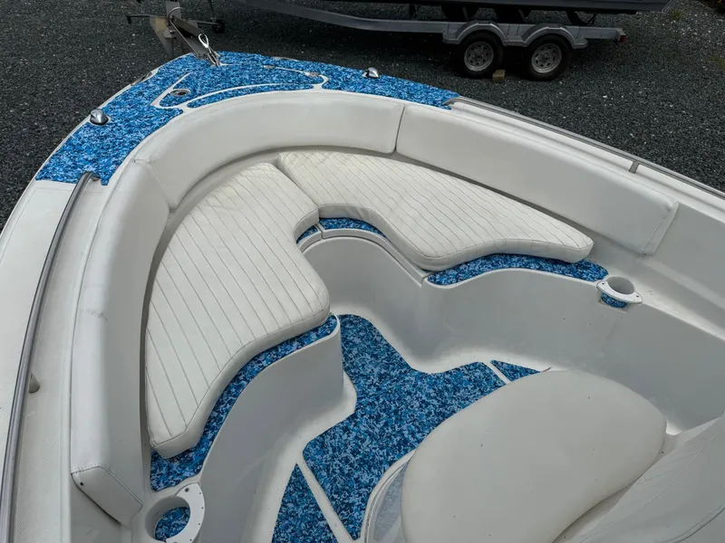 Slide: The Image of 2013 Sea Fox 199 Commander boat interior with white seating and blue flooring. - 14