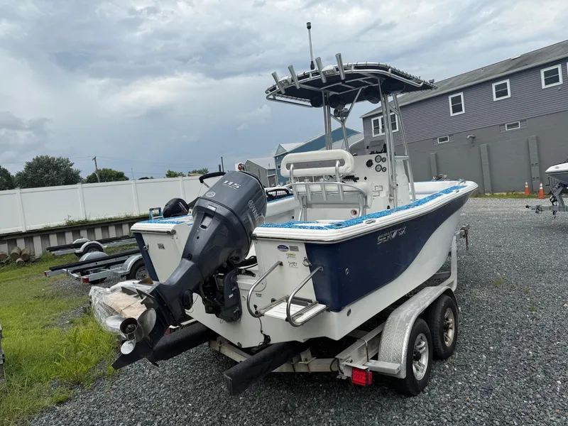 Slide: The Image of 2013 Sea Fox 199 Commander boat on trailer, featuring Yamaha 115 outboard motor. - 4