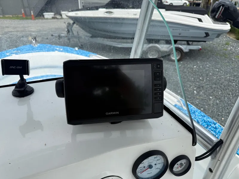Slide: The Image of Garmin GPS on 2013 Sea Fox 199 Commander boat dashboard, with speedometer and tachometer. - 6