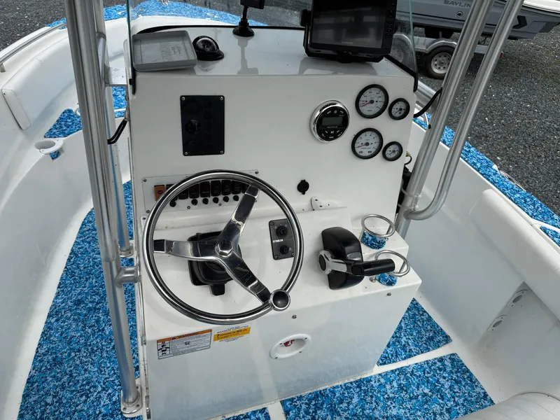 Slide: The Image of 2013 Sea Fox 199 Commander boat console with steering wheel and gauges. - 7