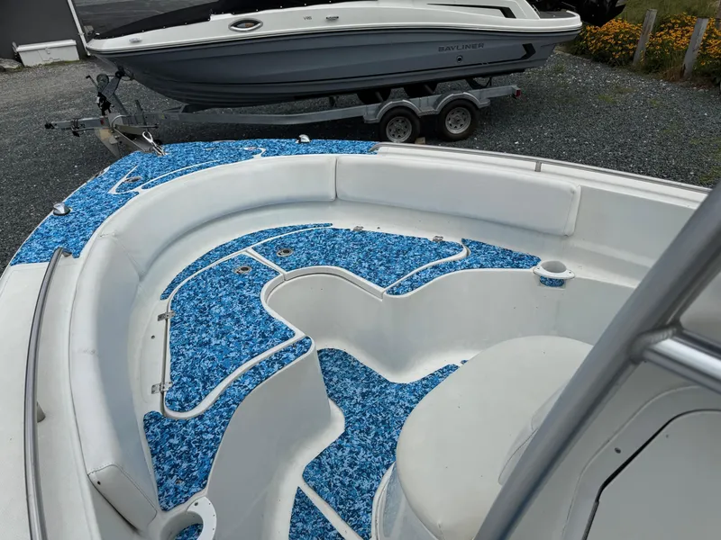 Slide: The Image of 2013 Sea Fox 199 Commander boat interior with blue patterned flooring. - 8