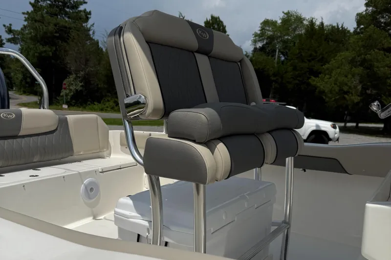 Slide: The Image of 2025 Key West 239 FS boat interior with cushioned seating and storage. - 3