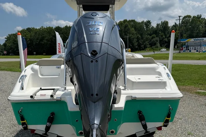 Slide: The Image of 2025 Key West 239 FS boat with Yamaha 300 V6 engine, parked outdoors. - 6