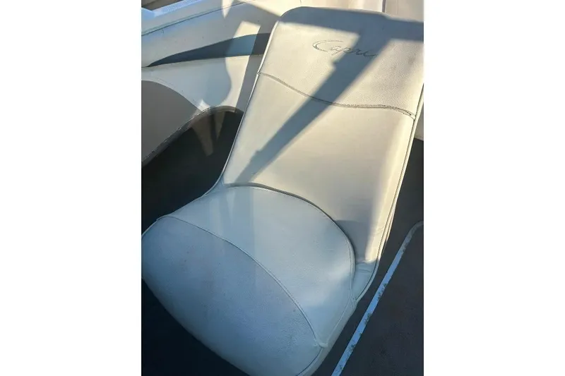 Slide: The Image of 2002 Bayliner 184 SF boat seat with "Capri" embroidery, in sunlight. - 13