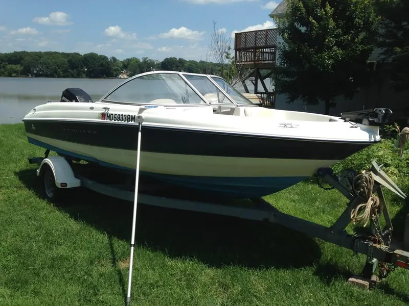 Slide: The Image of 2002 Bayliner 184 SF boat on trailer by a lakeside, sunny day. - 6
