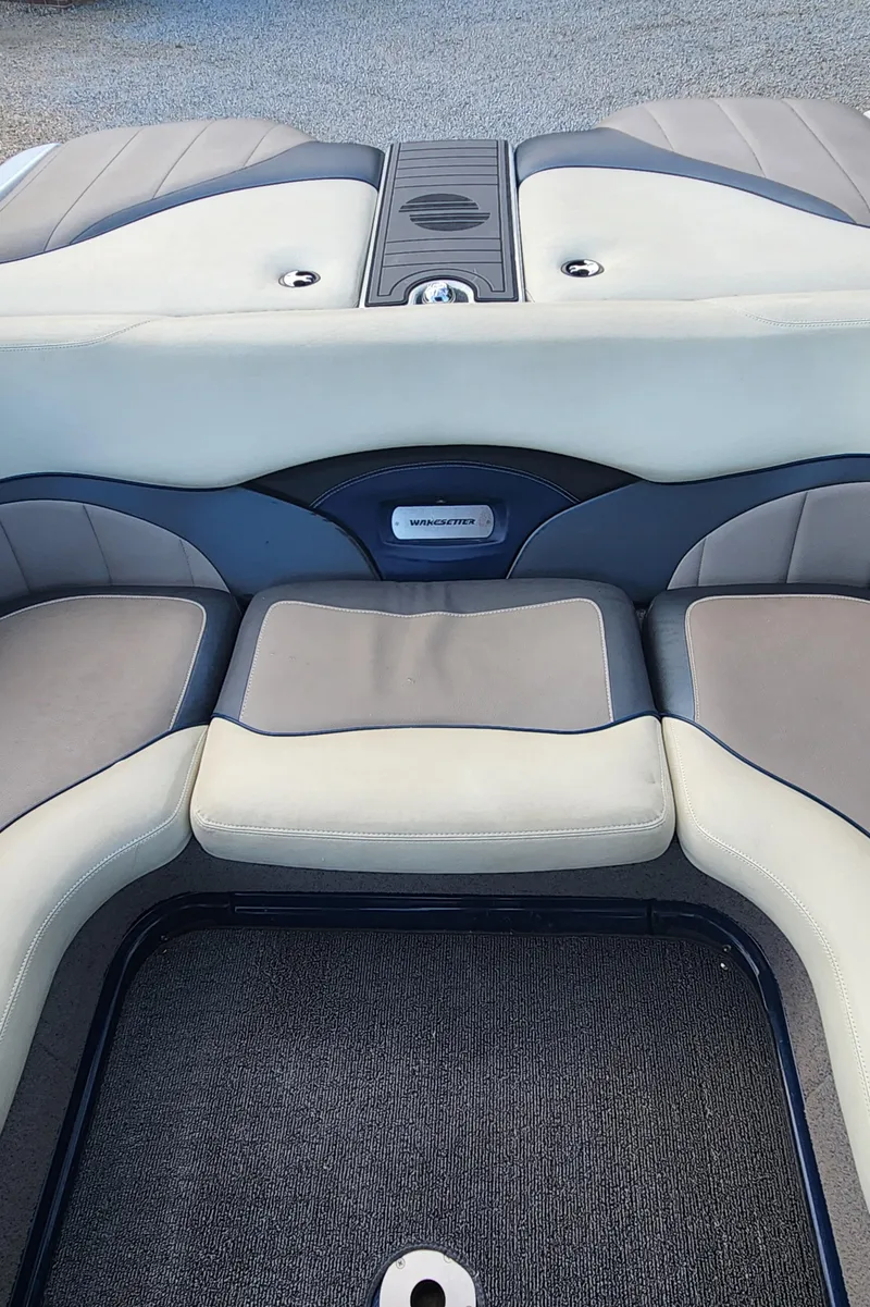 Slide: The Image of 2013 Malibu Wakesetter 23 LSV boat interior with cushioned seating. - 12