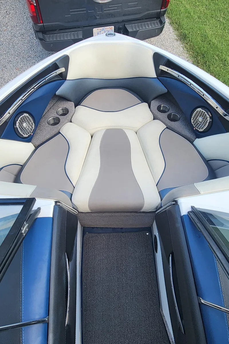 Slide: The Image of Interior of 2013 Malibu Wakesetter 23 LSV boat with cushioned seating and speakers. - 7