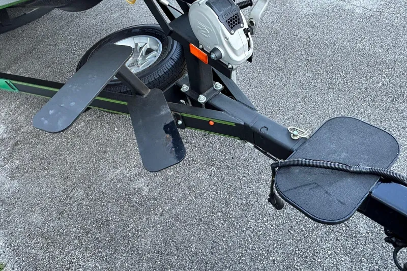 Slide: The Image of 2018 Skeeter ZX225 boat trailer hitch and wheel on pavement. - 2