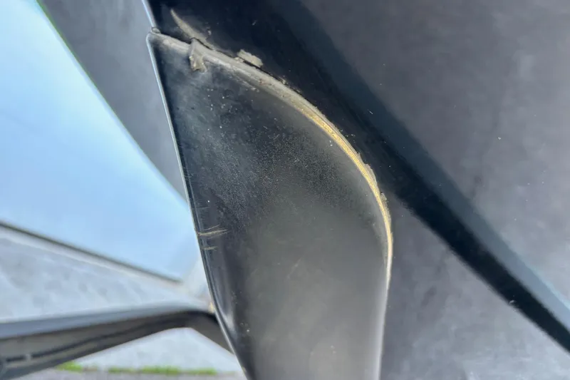 Slide: The Image of Close-up of a 2018 Skeeter ZX225 boat hull with visible wear. - 3