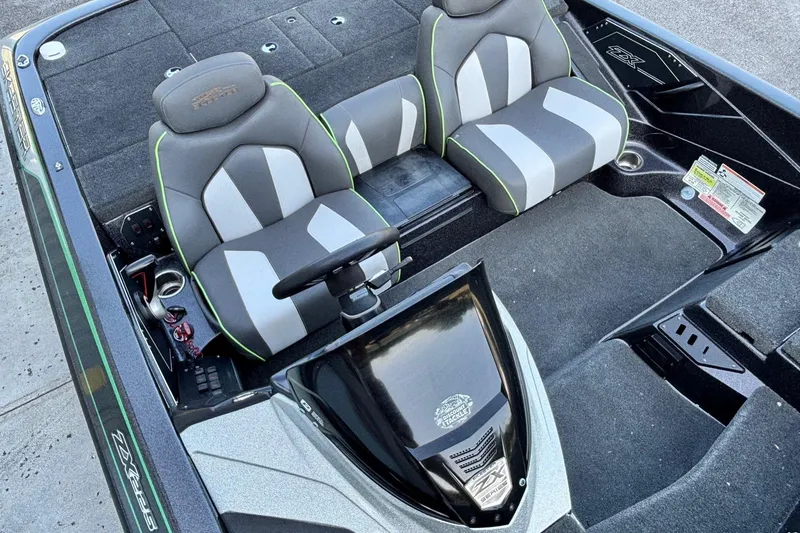 Slide: The Image of 2018 Skeeter ZX225 boat interior with dual seats and steering console. - 7