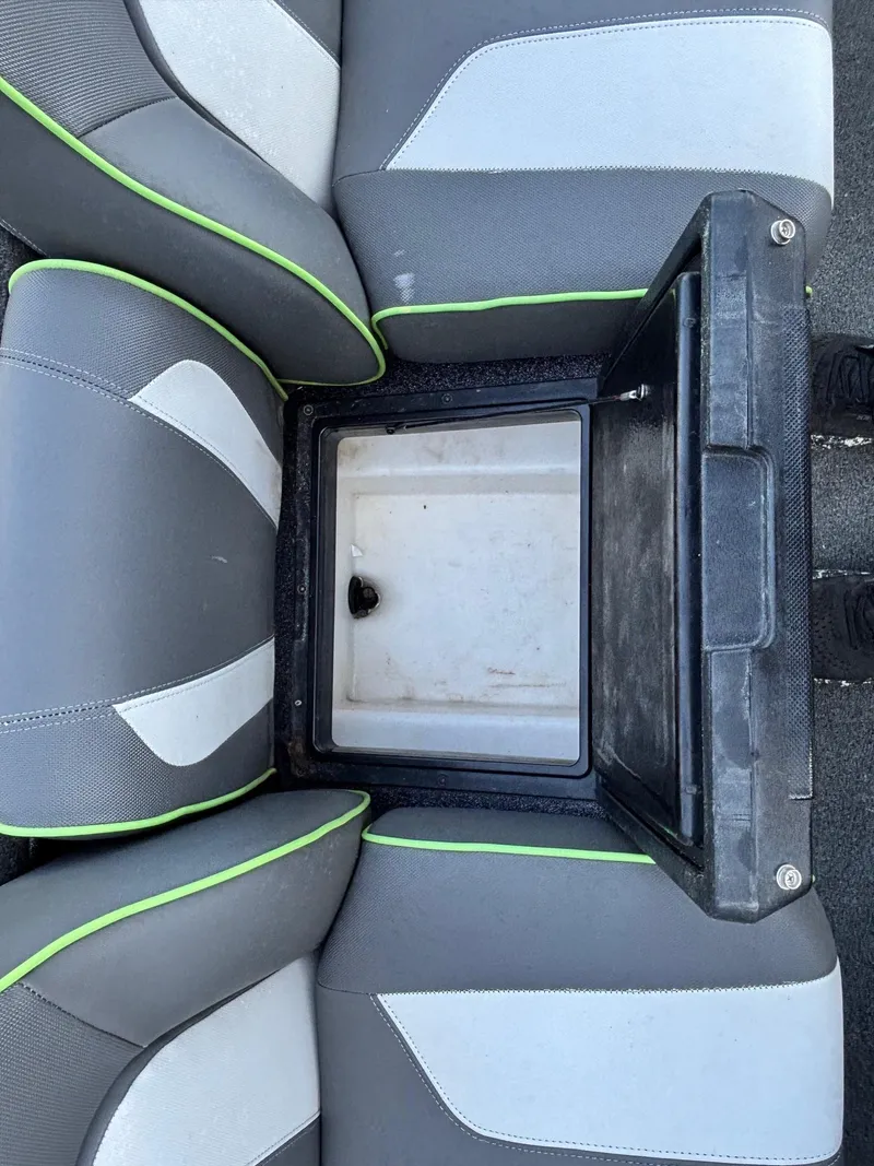 Slide: The Image of 2018 Skeeter ZX225 boat seat with open storage compartment. - 8