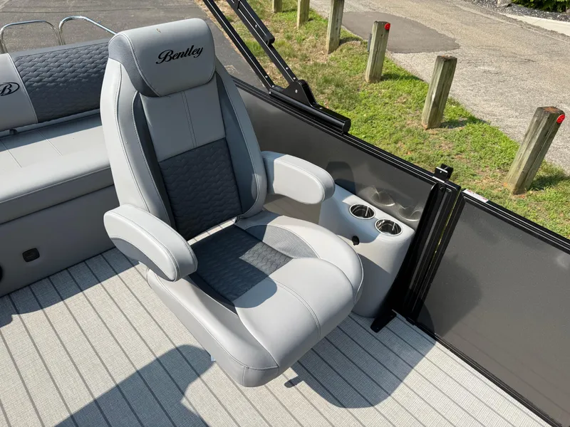 Slide: The Image of 2026 Bentley Pontoons Elite 223 Swingback Dual Capt. seat with cup holders on deck. - 11