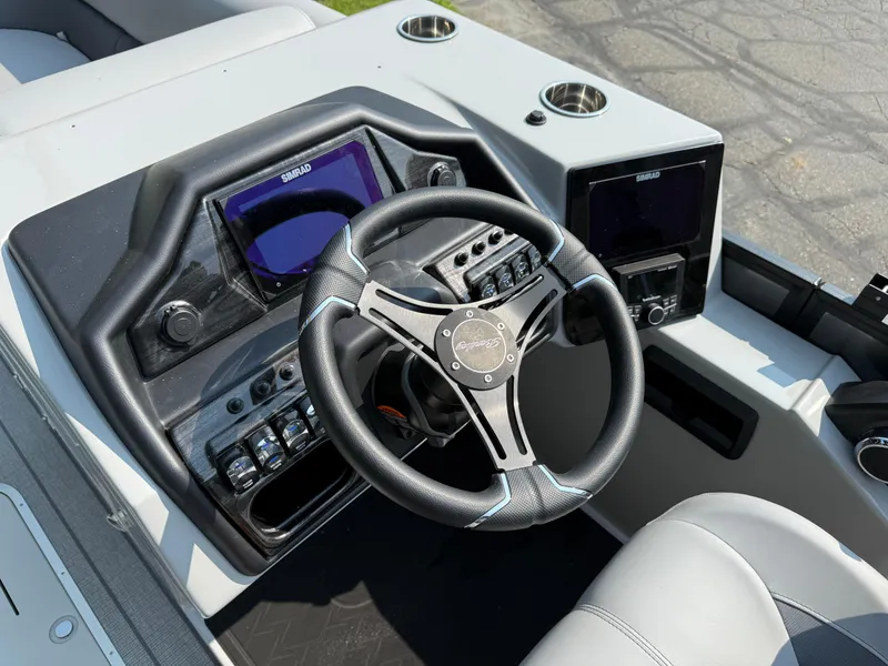 Slide: The Image of 2026 Bentley Pontoons Elite 223 Swingback Dual Capt. dashboard with steering wheel and controls. - 14