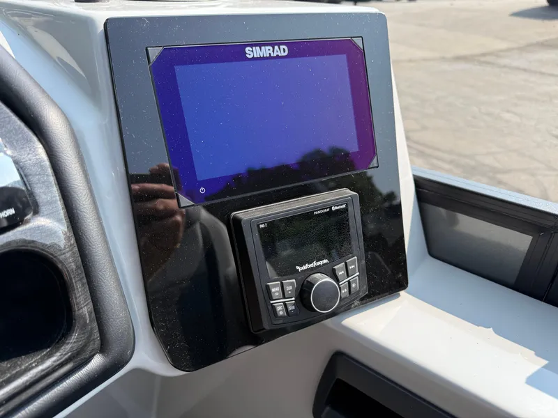 Slide: The Image of Simrad display and Rockford Fosgate audio system on 2026 Bentley Pontoons Elite 223. - 16
