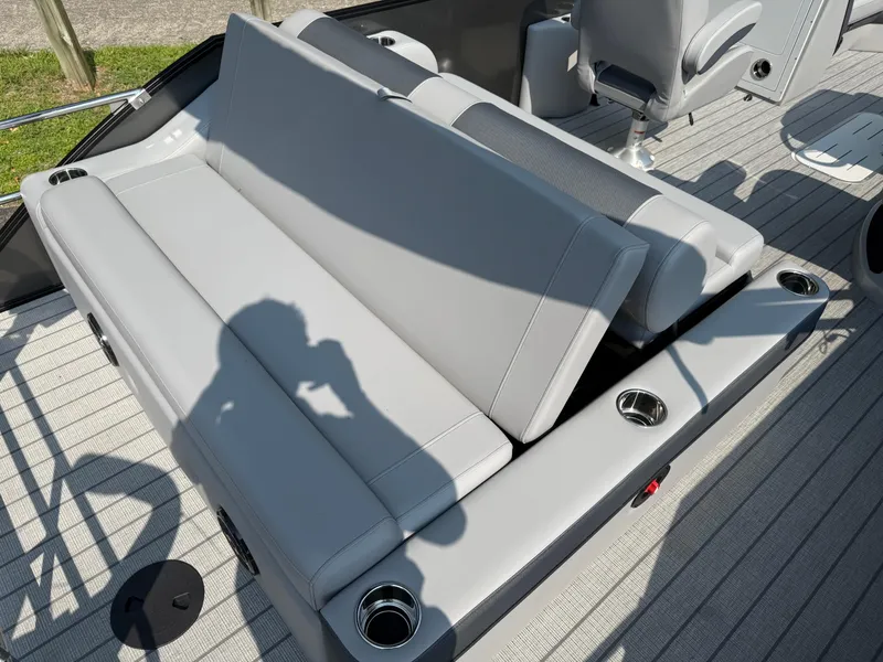 Slide: The Image of 2026 Bentley Pontoons Elite 223 Swingback Dual Capt. with luxurious seating and cup holders. - 18