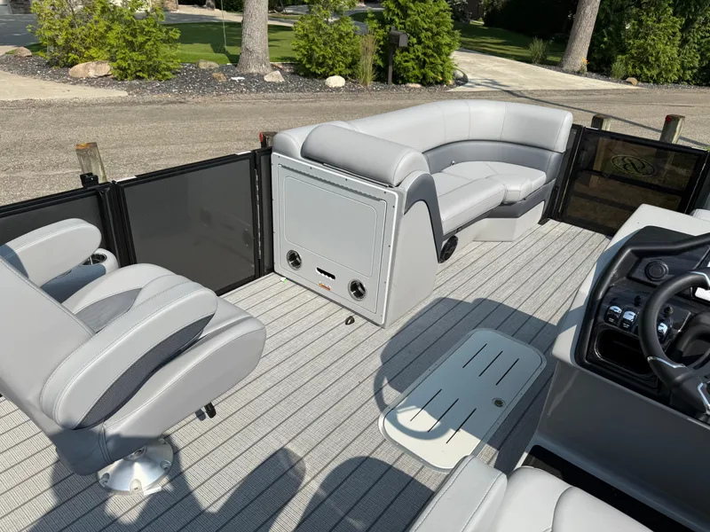 Slide: The Image of 2026 Bentley Pontoons Elite 223 interior with gray seating and modern dashboard. - 22