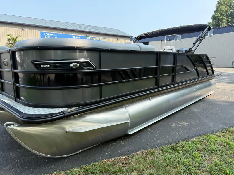 Slide: The Image of 2026 Bentley Pontoons Elite 223 Swingback Dual Capt. on display outdoors. - 5