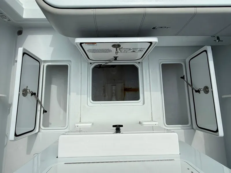 Slide: The Image of 2023 Contender 30 Tournament boat storage compartments and hatch interior view. - 26