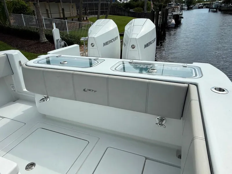 Slide: The Image of 2023 Contender 30 Tournament boat with dual Mercury engines, featuring a sleek deck design. - 29