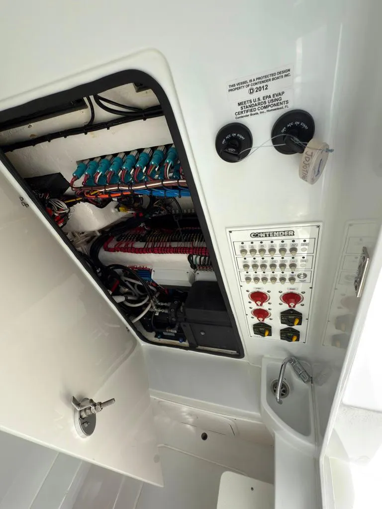 Slide: The Image of Electrical panel and wiring inside a 2023 Contender 30 Tournament boat. - 39