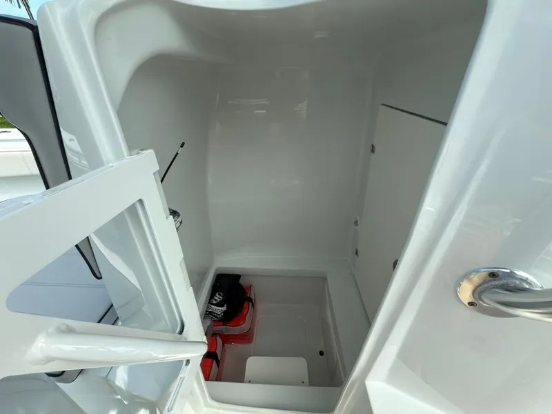 Slide: The Image of Interior of 2023 Contender 30 Tournament boat, featuring storage compartment and sleek design. - 40