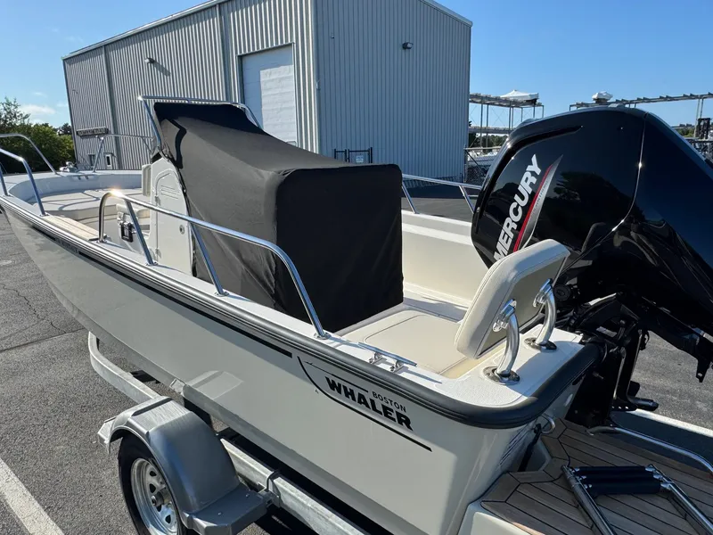 Slide: The Image of 2025 Boston Whaler 170 Montauk boat with Mercury engine on trailer. - 6