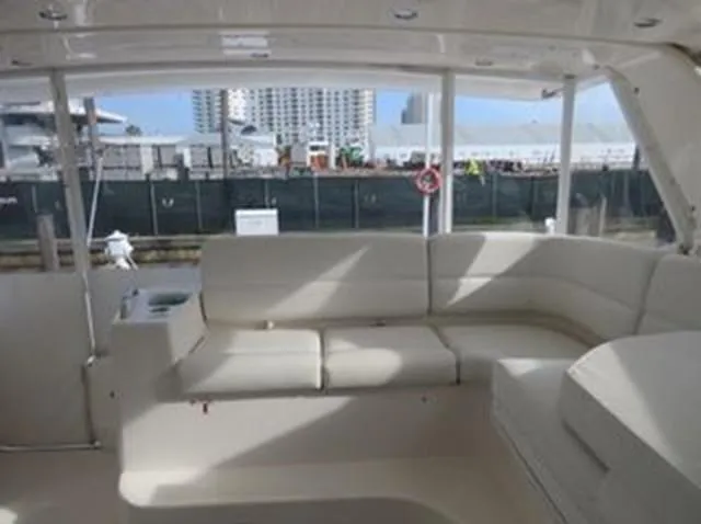 Slide: The Image of Interior view of 2000 Tiara Yachts 5200 Express with spacious seating area. - 14