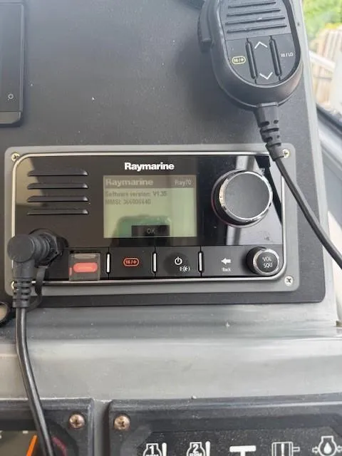 Slide: The Image of Raymarine marine radio system on 2000 Tiara Yachts 5200 Express dashboard. - 20