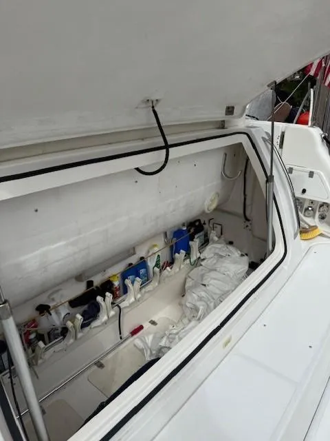 Slide: The Image of Open storage compartment on a 2000 Tiara Yachts 5200 Express boat. - 25