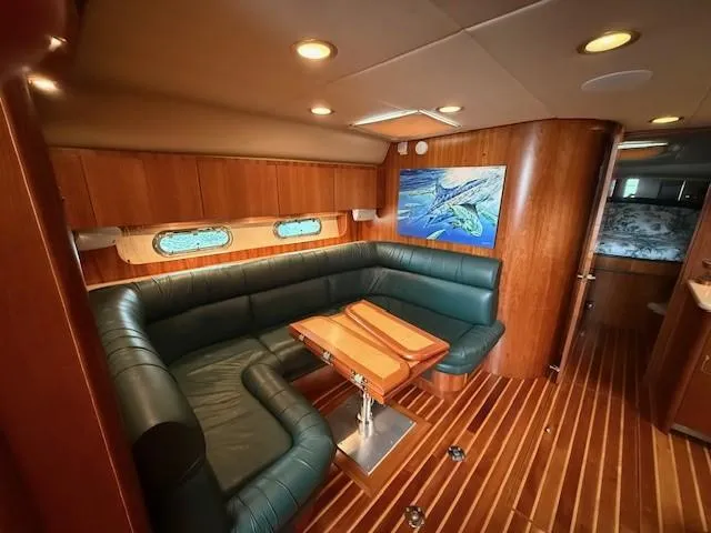 Slide: The Image of Luxurious 2000 Tiara Yachts 5200 Express interior with leather seating and wooden accents. - 29