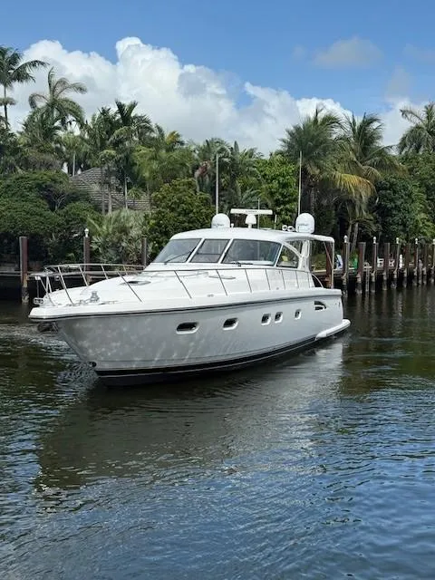 Slide: The Image of 2000 Tiara Yachts 5200 Express cruising on a tropical waterway. - 3