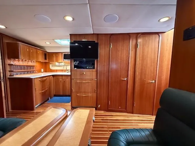Slide: The Image of Luxurious interior of 2000 Tiara Yachts 5200 Express with wood finishes and modern amenities. - 31