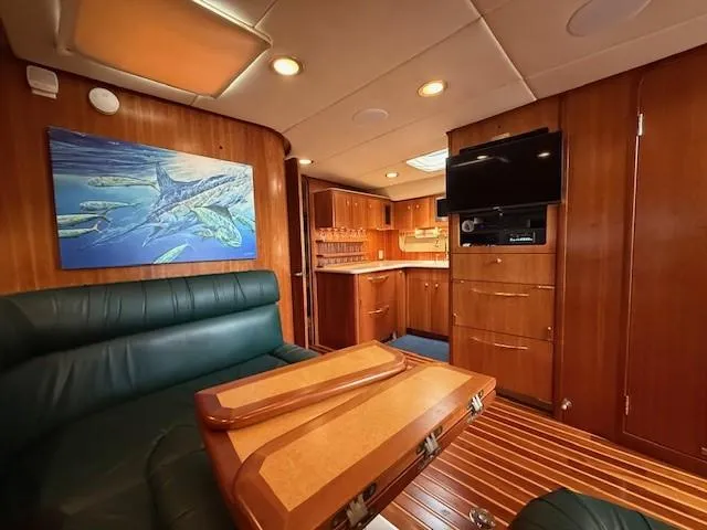 Slide: The Image of Interior of 2000 Tiara Yachts 5200 Express with wood paneling and modern amenities. - 32