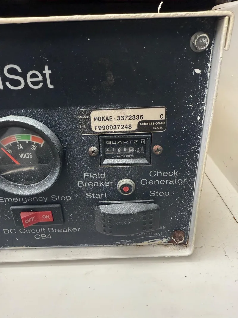 Slide: The Image of Control panel of a 2000 Tiara Yachts 5200 Express with voltmeter and hour meter. - 48