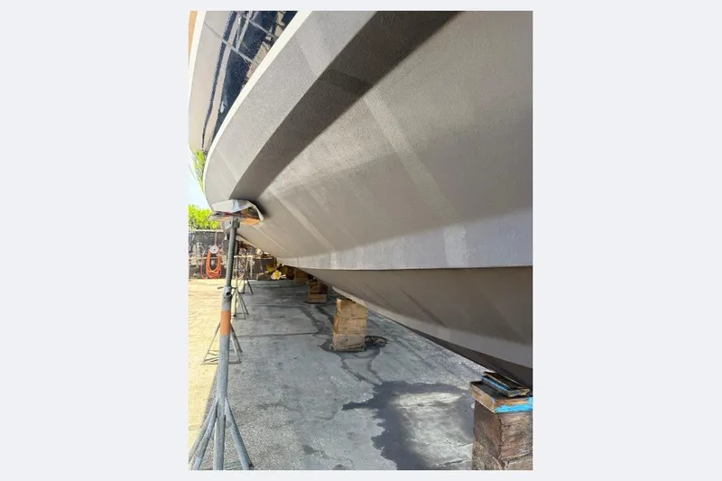 Slide: The Image of 2000 Tiara Yachts 5200 Express hull on dry dock, supported by stands. - 62