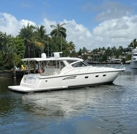 Slide: The Image of 2000 Tiara Yachts 5200 Express cruising on a tropical waterway. - 8