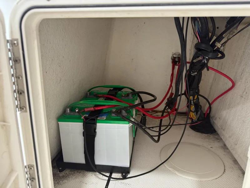 Slide: The Image of Battery compartment of a 2013 Key West 186CC boat with wiring connections. - 10