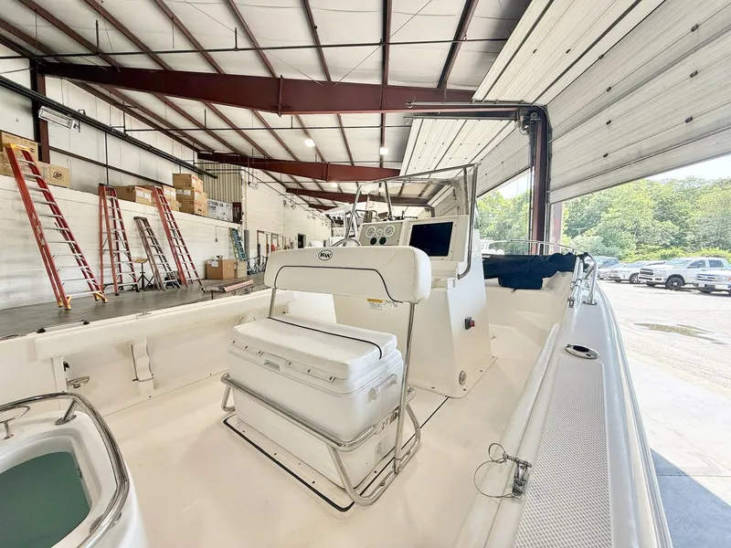 Slide: The Image of 2013 Key West 186CC boat in a warehouse, surrounded by ladders and equipment. - 3