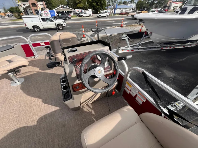 Slide: The Image of 2023 Sun Tracker Bass Buggy 18 DLX pontoon boat interior with steering console and seating. - 11