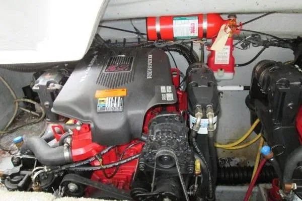 Slide: The Image of 2004 Crownline 288 BR engine compartment with visible fire extinguisher and wiring. - 14