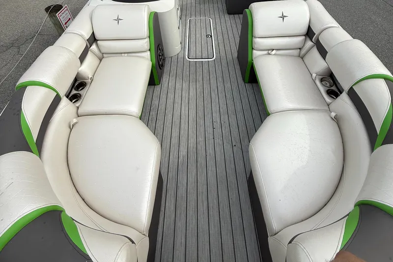 Slide: The Image of 2020 Berkshire 23SB STS Entertainment boat interior with white and green seating. - 6