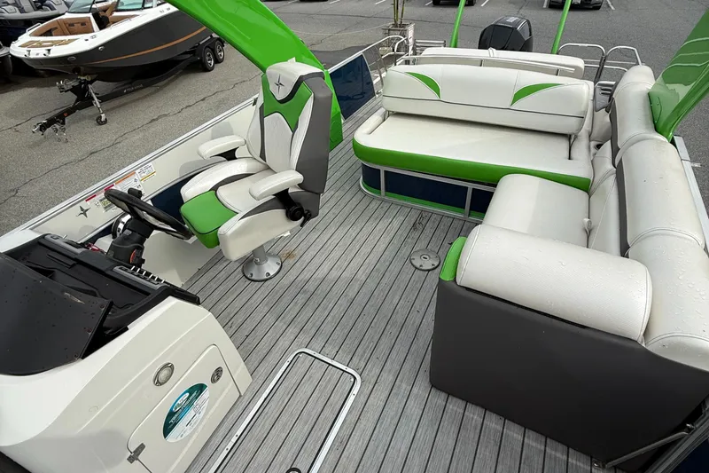 Slide: The Image of 2020 Berkshire 23SB STS Entertainment pontoon boat interior with green and white seating. - 7