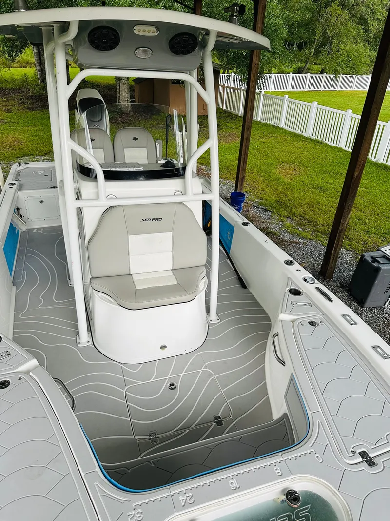 Slide: The Image of 2019 Sea Pro 248 Bay boat with sleek interior and modern design. - 10