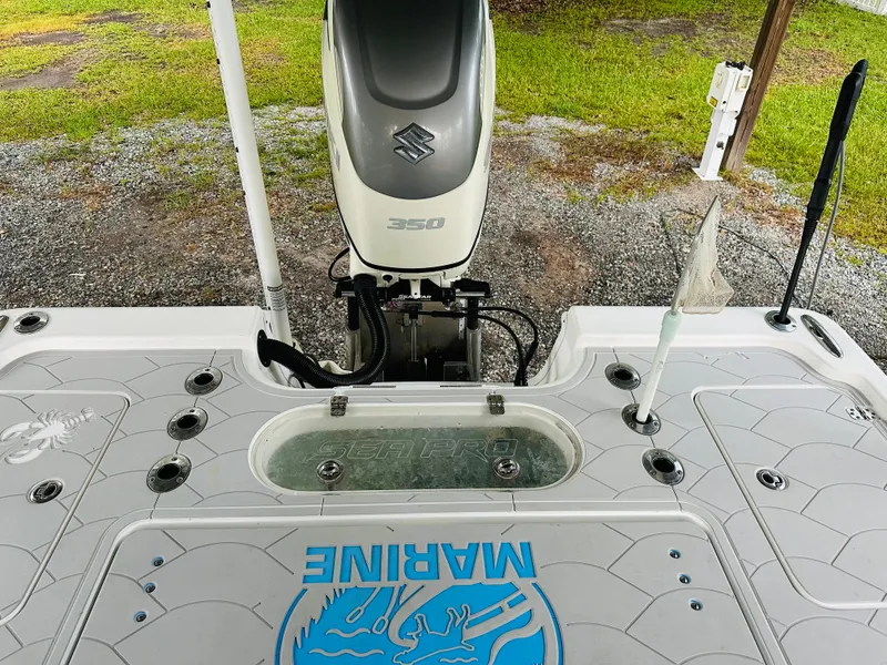 Slide: The Image of 2019 Sea Pro 248 Bay boat with Suzuki 350 engine, featuring a clean deck layout. - 4
