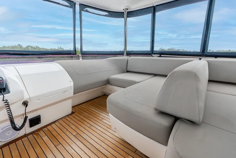 Slide: The Image of Luxurious 2018 Princess F-68 yacht interior with elegant seating and scenic water view. - 11