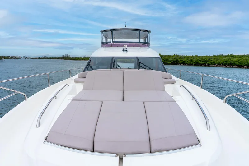 Slide: The Image of Luxurious 2018 Princess F-68 yacht deck with elegant seating and scenic water view. - 12